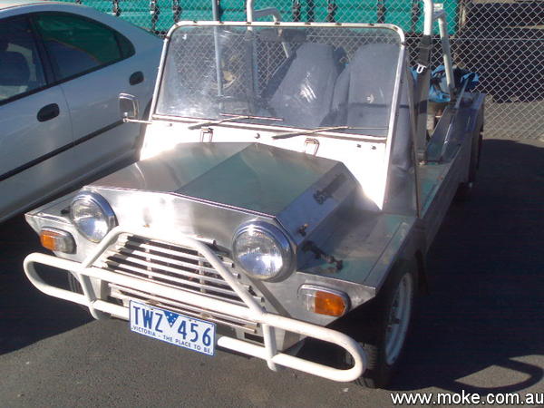 A stainless steel Super Moke in a transport yard in Victoria.