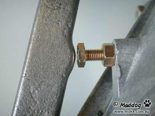 Picture of the adjusting bolt on the clutch cove of a Moke