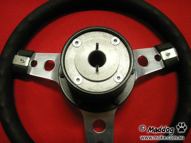 A picture of a steering wheel ona Moke