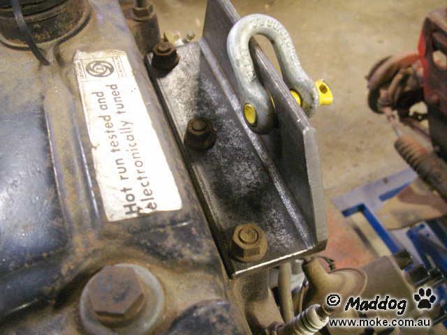 A lifting bracket attached to the engine of Moke in the car