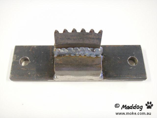 A picture of a piece of metal with teeth to lock up the flywheel