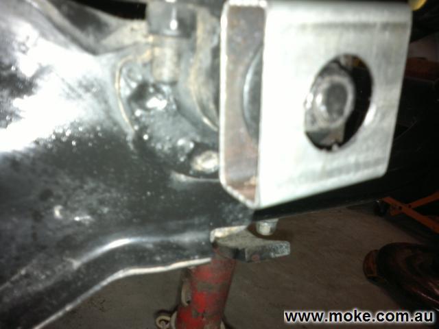 A picture of a piece of square hollow section metal over the rear bolt on the Moke sub frame